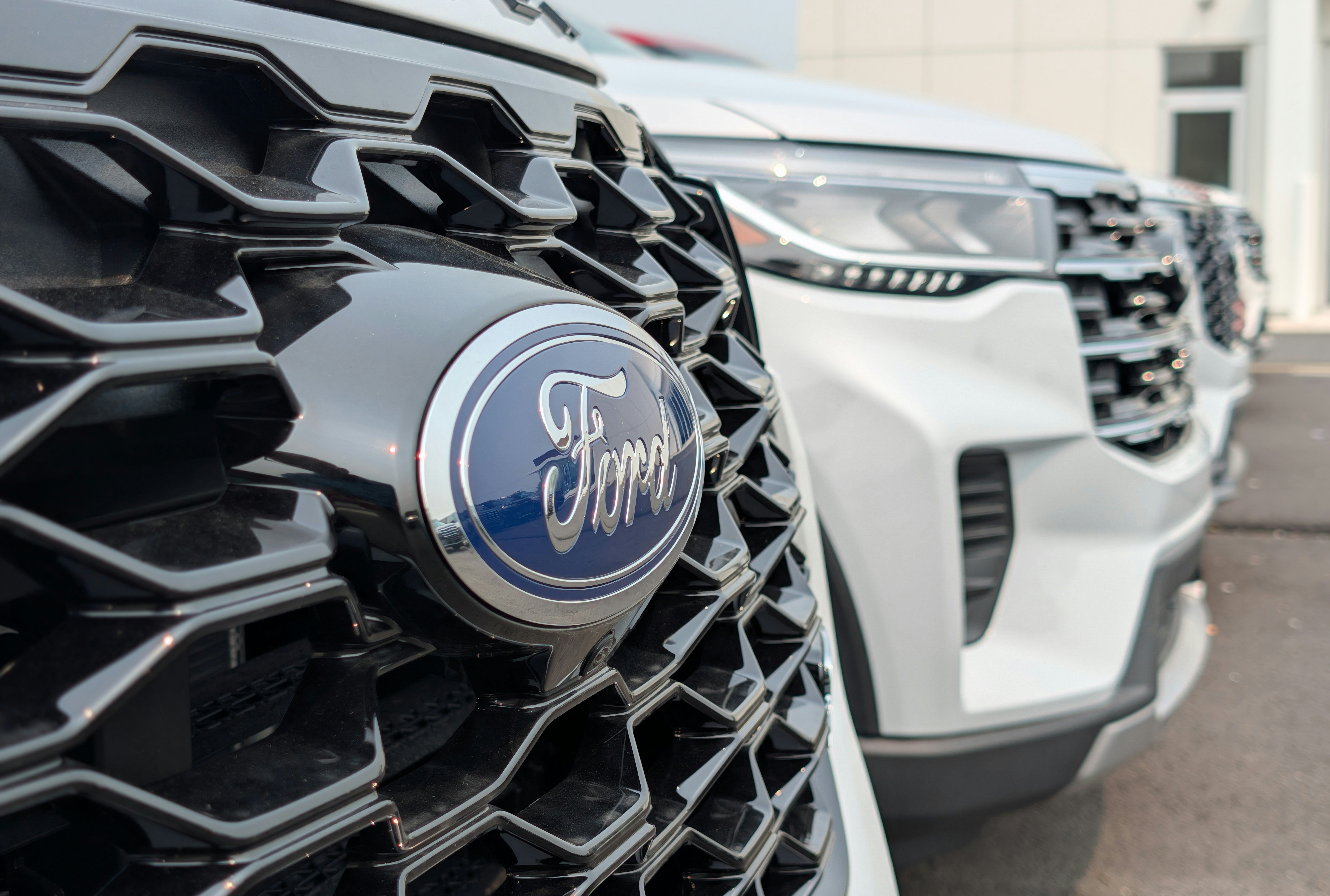 Ford vehicles lined up outside of Ford dealership for financing